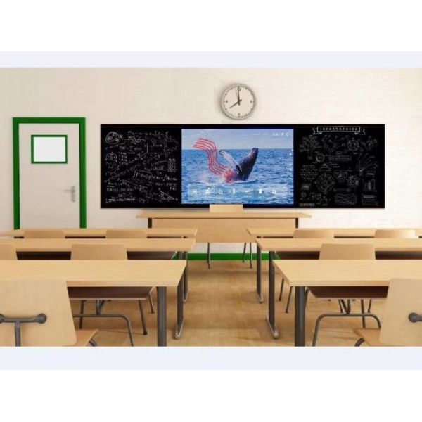 A full classroom setting with student desks facing a large central smart blackboard