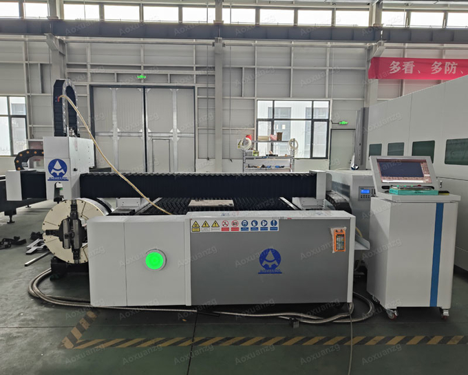Open Type 3015 Three Chuck Tube And Plate Fiber Laser Cutting Machine 3000w CNC Laser Cutter With Exchange Platform