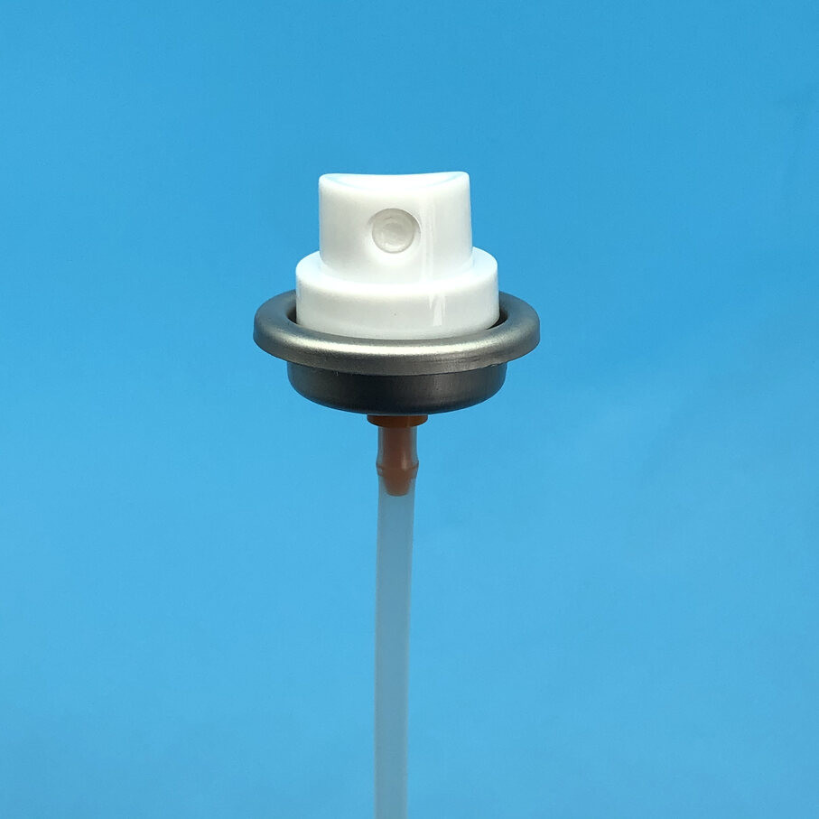 Sunscreen mist valve in use demonstrating fine mist spray