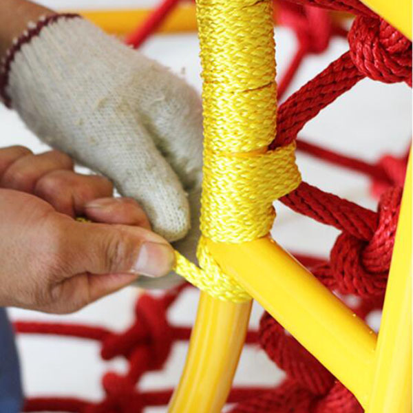 Handmade rope net playground structure showing vibrant colors and secure construction